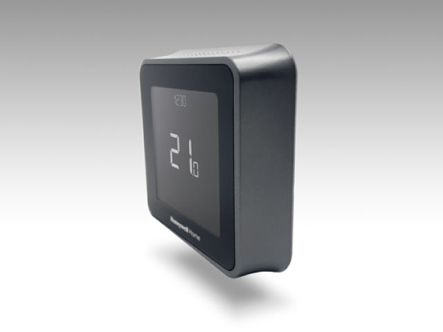 Text: Side profile of the Honeywell T5 Smart Thermostat displaying 21 degrees on the screen.